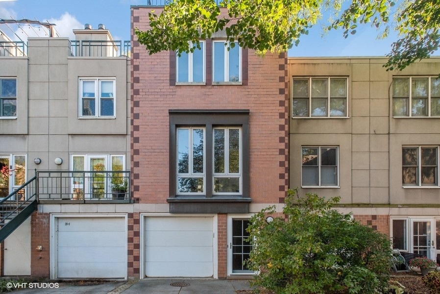 a view of brick building next to a yard