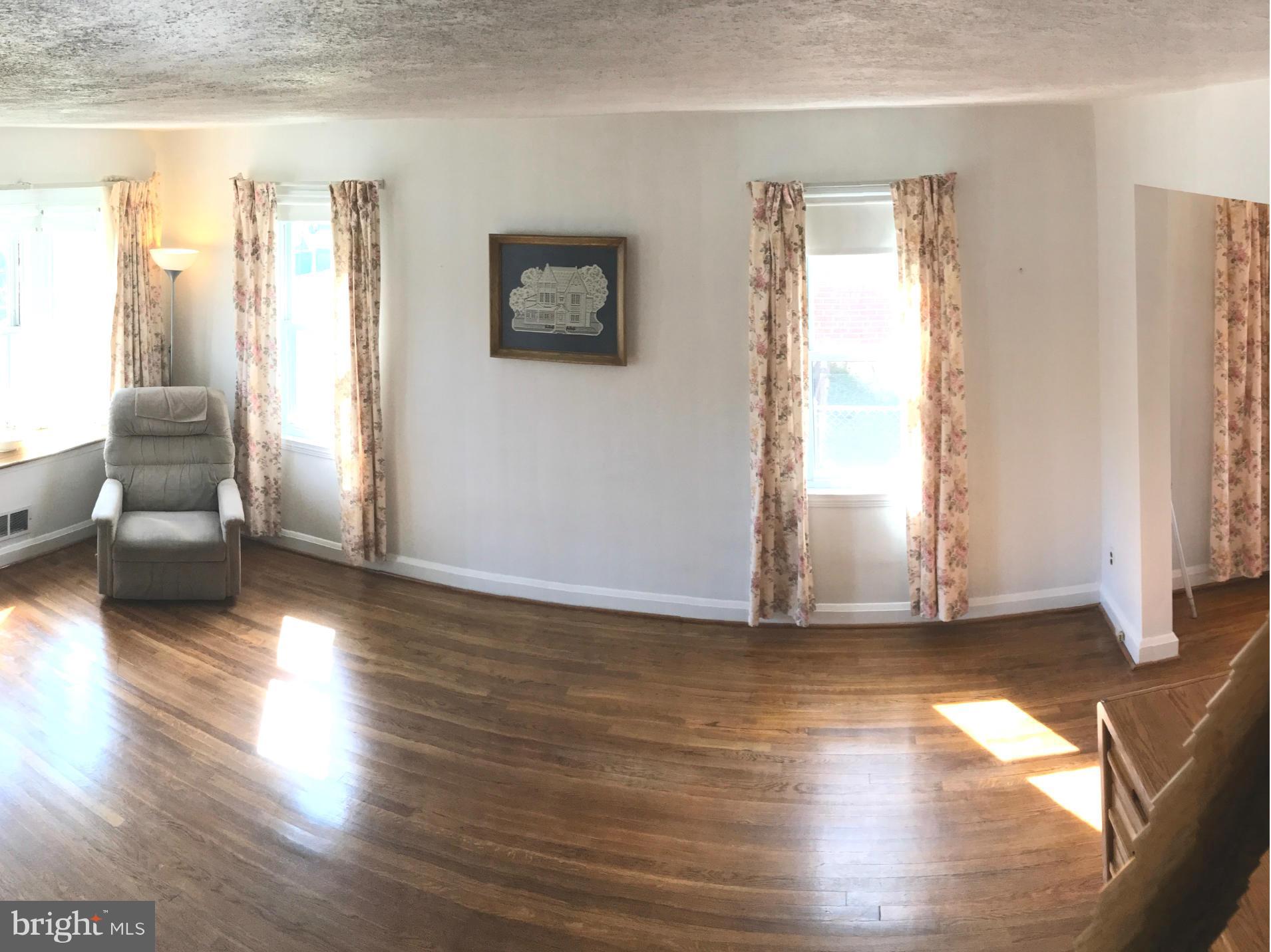 928 Arncliffe Road Baltimore, MD 21221 - Photo 7 of 27 Spacious Living Room with Hardwood Floors
