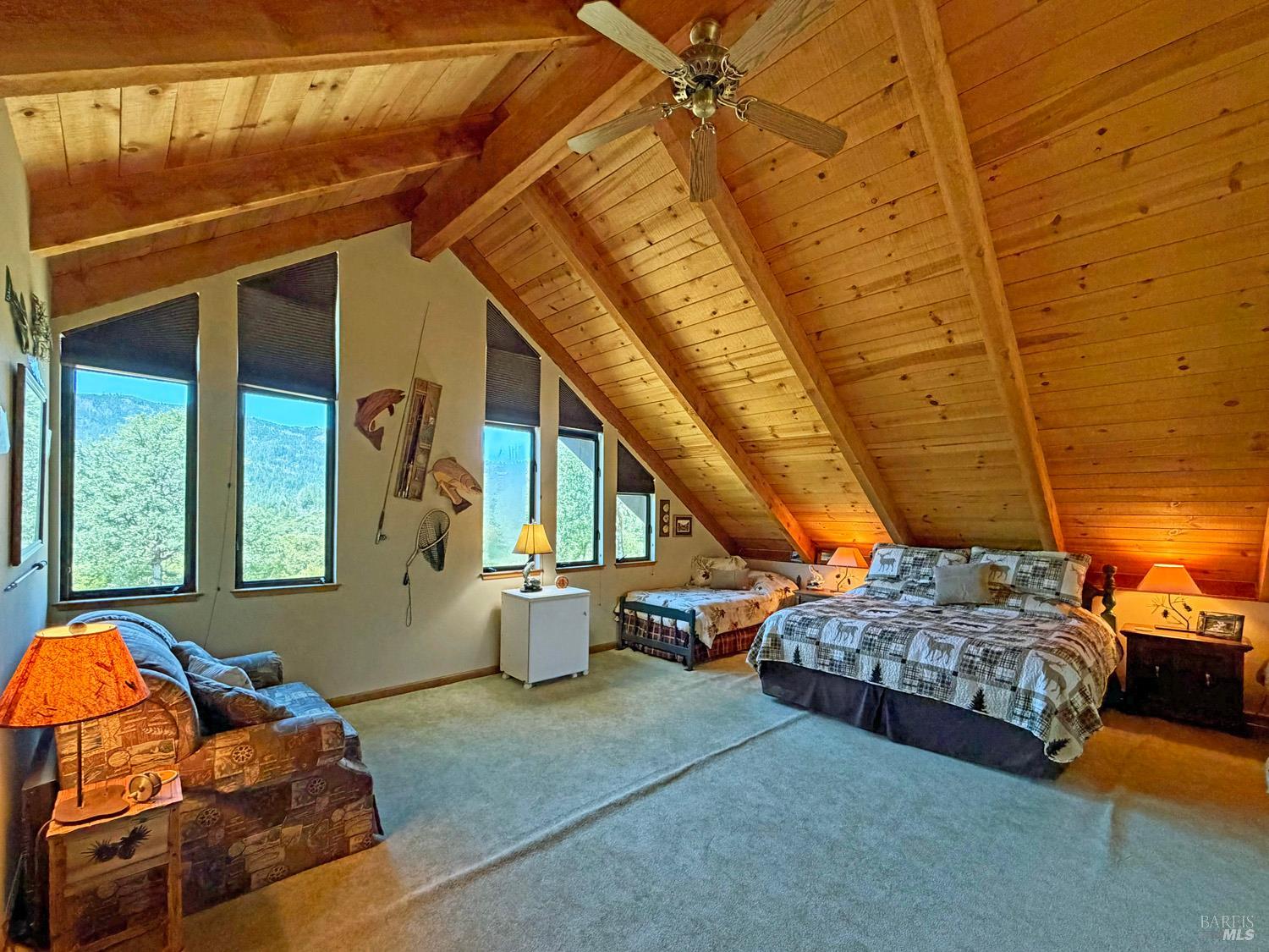 31312 High Point Road Potter Valley, CA 95469 - Photo 29 of 58 a living room with furniture and a floor to ceiling window