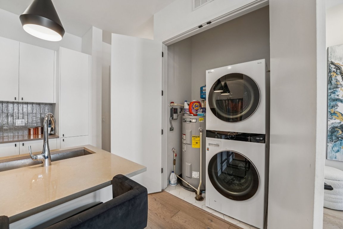 800 Embassy Drive, Unit 429 Austin, TX 78702 - Photo 11 of 40 a room with a washer and dryer