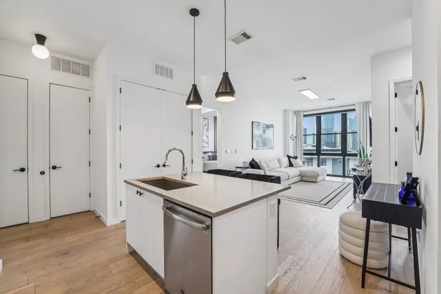 a kitchen that has a sink and a table in it