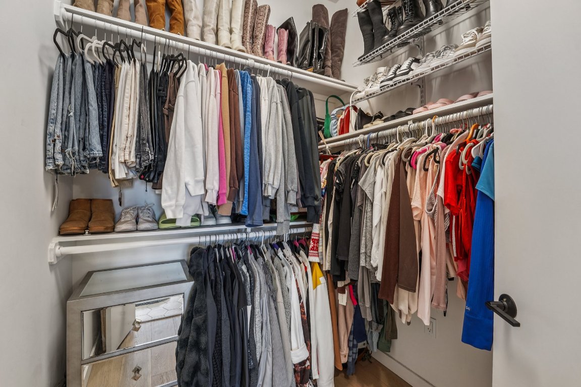 800 Embassy Drive, Unit 429 Austin, TX 78702 - Photo 17 of 40 a view of walk in closet with clothes