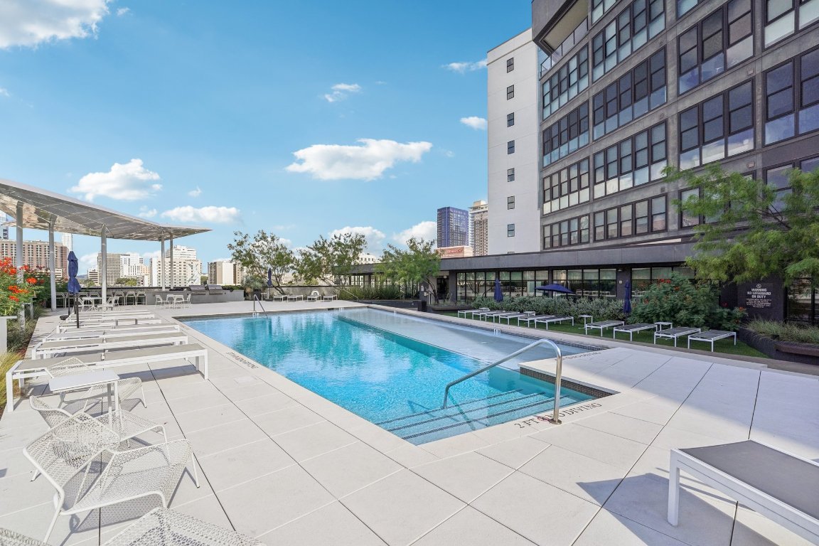 800 Embassy Drive, Unit 429 Austin, TX 78702 - Photo 23 of 40 a view of a swimming pool with outdoor seating