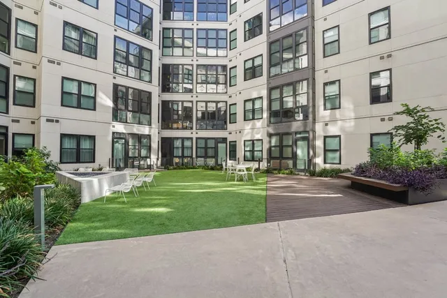 a view of a building with a yard