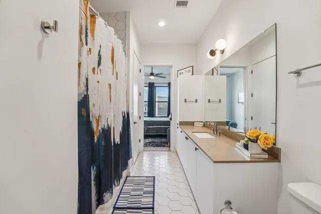 a kitchen with stainless steel appliances granite countertop a refrigerator and a stove