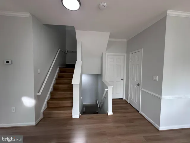 a view of entryway with wooden floor