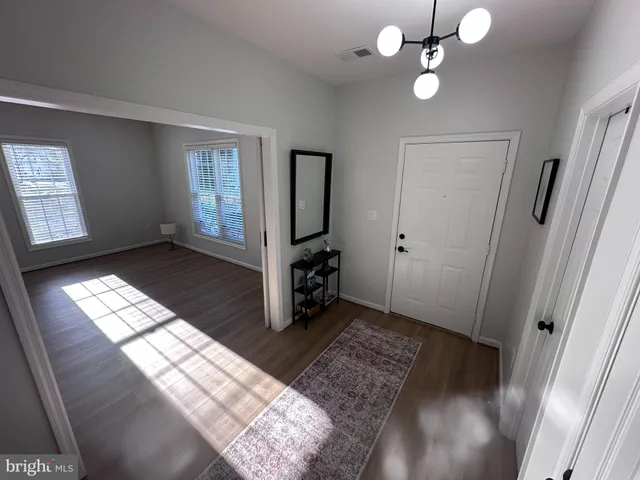 a view of entryway with wooden floor