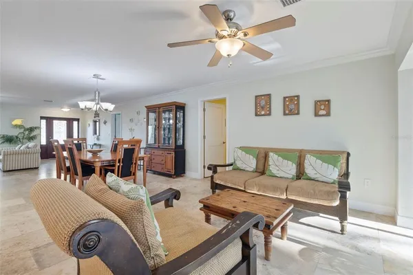 a dining room with furniture and window
