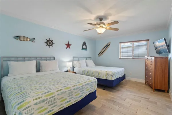 a living room with furniture and a ceiling fan