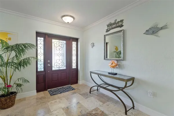 a room that has painting and a table in it