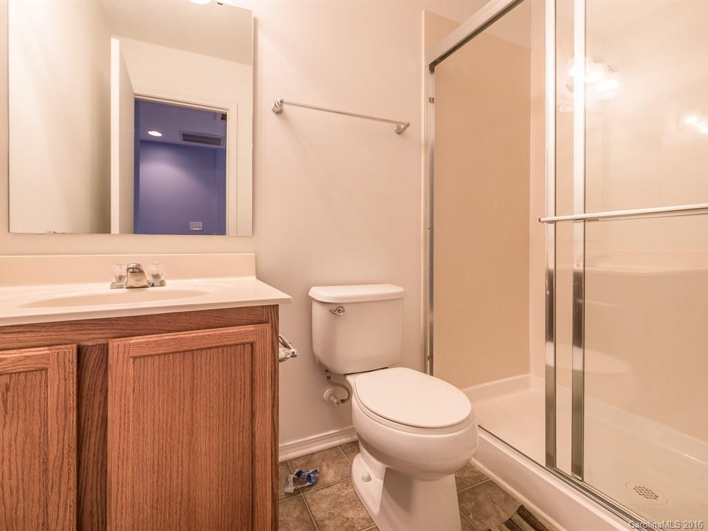 653 Potter Place Road, Unit 110 Fort Mill, SC 29708 - Photo 22 of 22 a bathroom with a sink a toilet and shower
