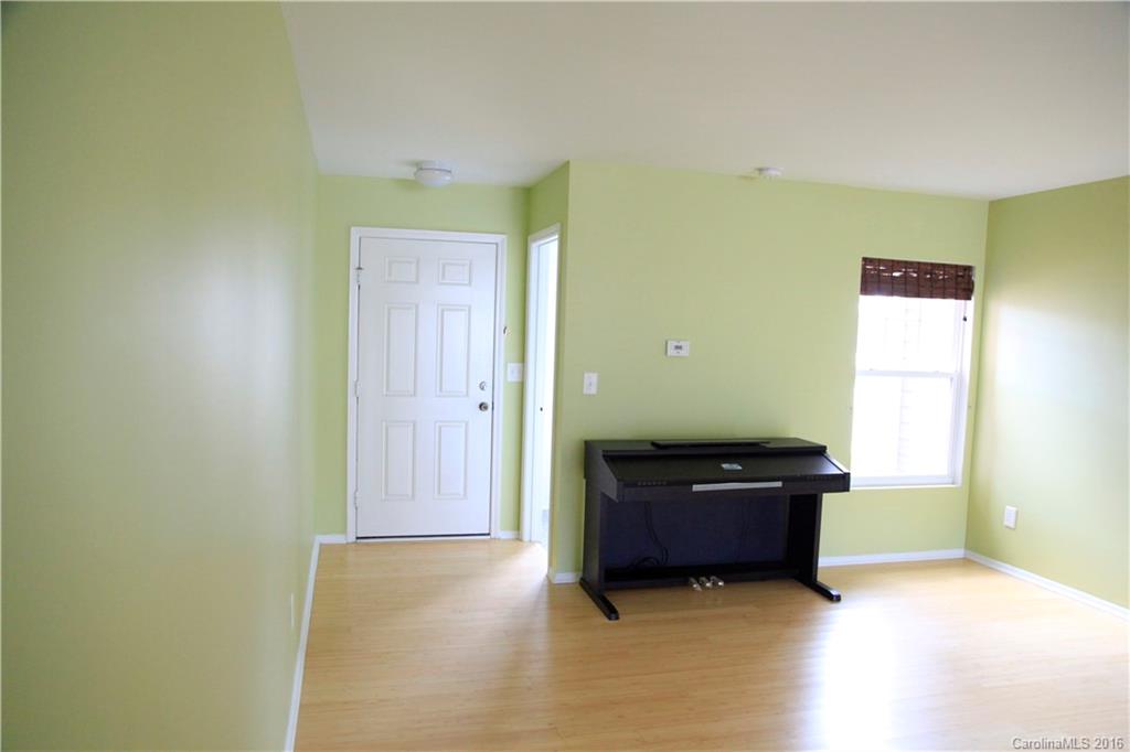 653 Potter Place Road, Unit 110 Fort Mill, SC 29708 - Photo 4 of 22 a living room with a couch and a window
