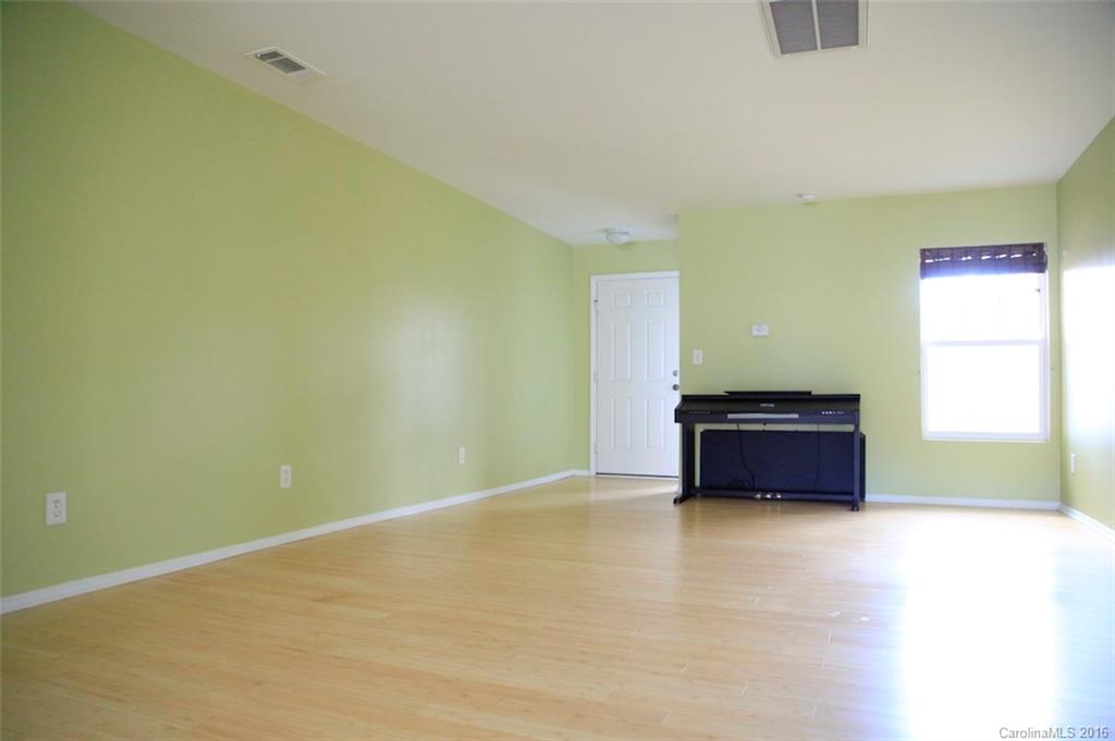 653 Potter Place Road, Unit 110 Fort Mill, SC 29708 - Photo 5 of 22 an empty room with windows
