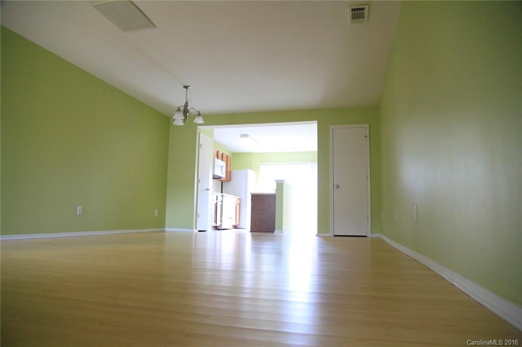 653 Potter Place Road, Unit 110 Fort Mill, SC 29708 - Photo 6 of 22 a view of a room with wooden floor