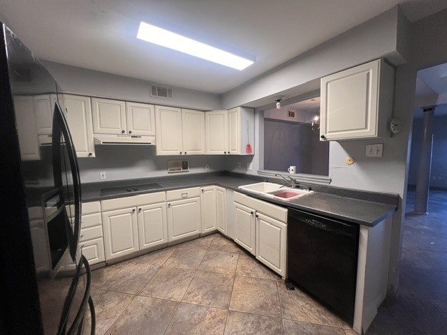 6304 South Rice Avenue Bellaire, TX 77401 - Photo 3 of 16 a kitchen with granite countertop a sink stove and refrigerator