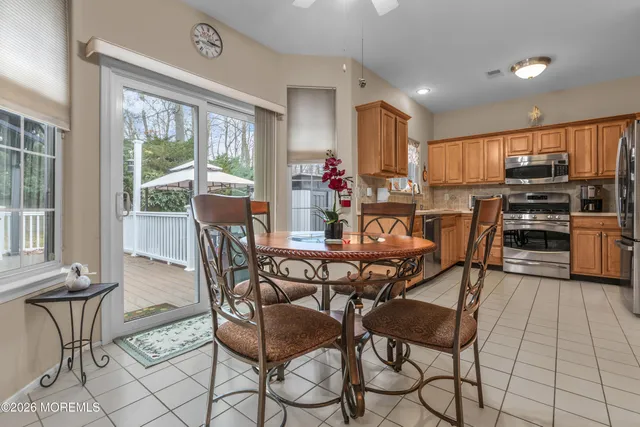 a view of a dining room with furniture window and outside view