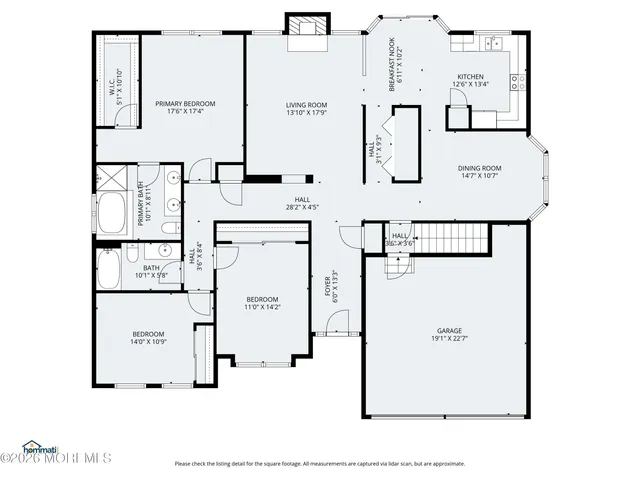 a bathroom with a tub and shower