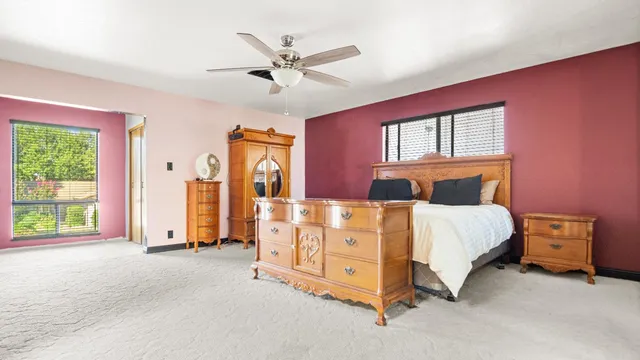 a bed room with a bed and a window