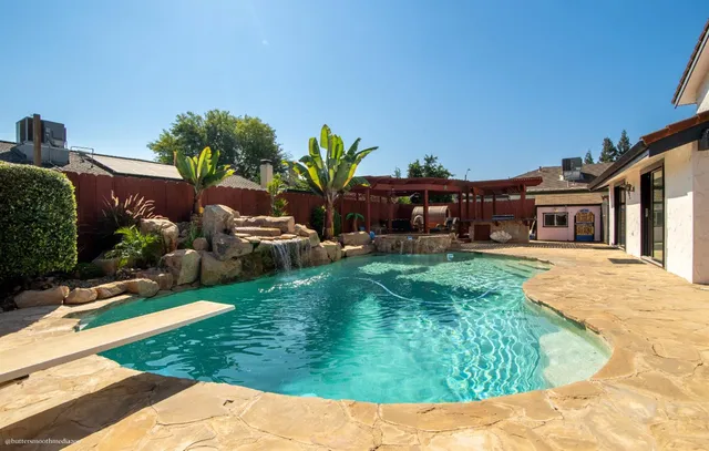 a view of a house with a yard porch and sitting area
