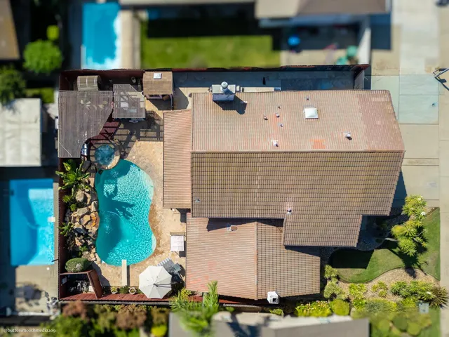 an aerial view of houses with outdoor space