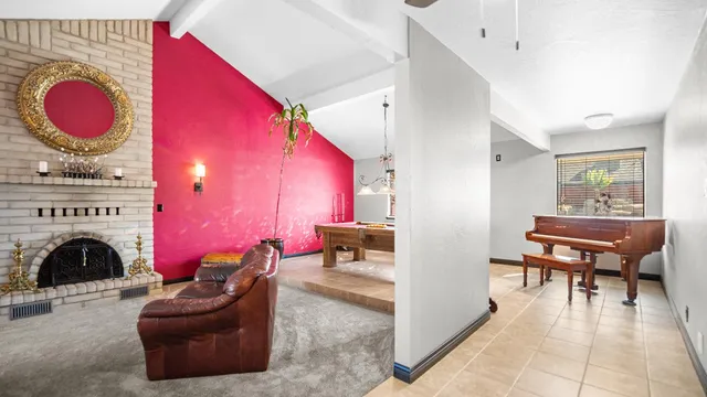 a bedroom with furniture and a fireplace