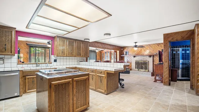 a kitchen with a sink stove and cabinets