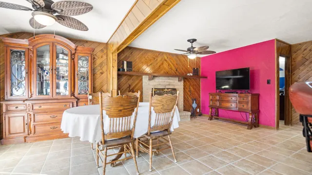 a living room with fireplace furniture and a flat screen tv