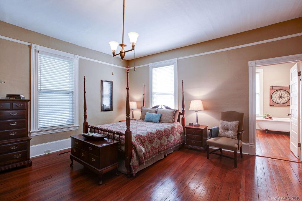 1003 Ferguson Ridge Road Gastonia, NC 28052 - Photo 14 of 36 a spacious bedroom with a bed and wooden floor
