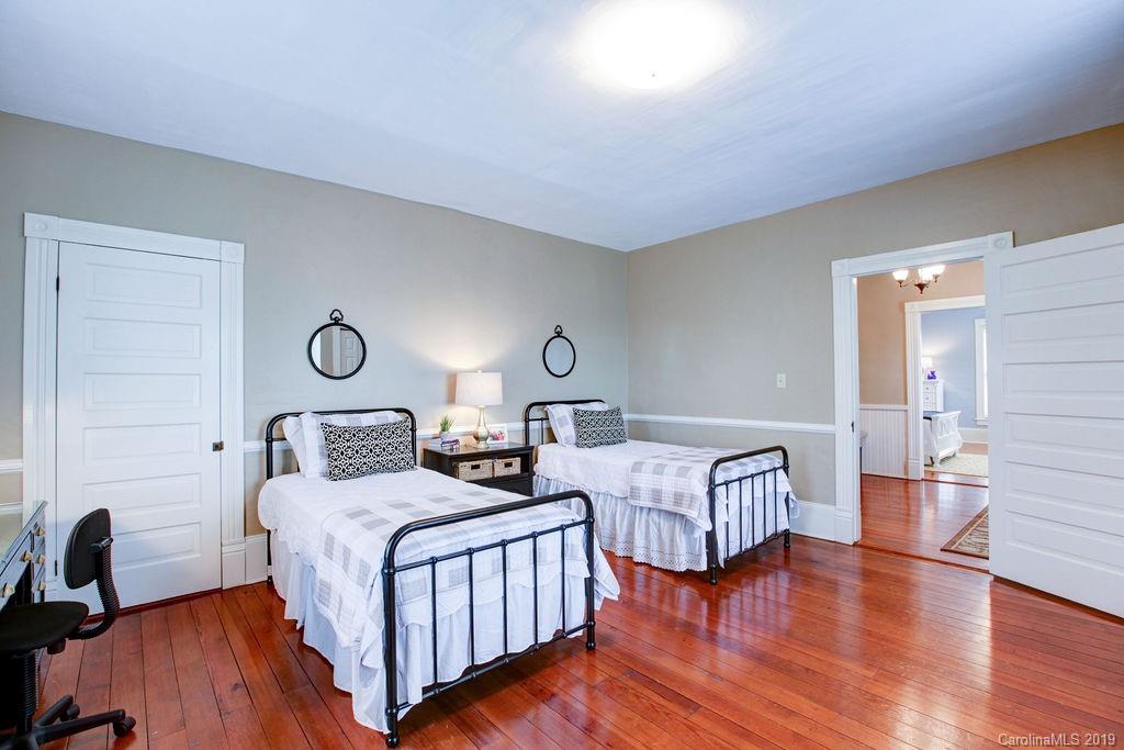 1003 Ferguson Ridge Road Gastonia, NC 28052 - Photo 22 of 36 a bedroom with two beds and a table