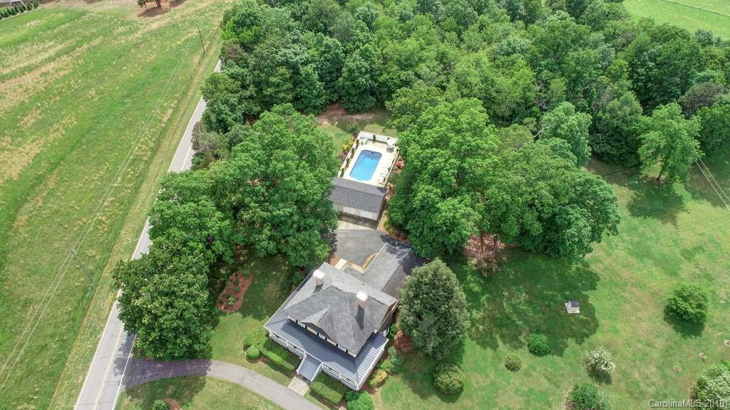 1003 Ferguson Ridge Road Gastonia, NC 28052 - Photo 36 of 36 an aerial view of a house with swimming pool and garden