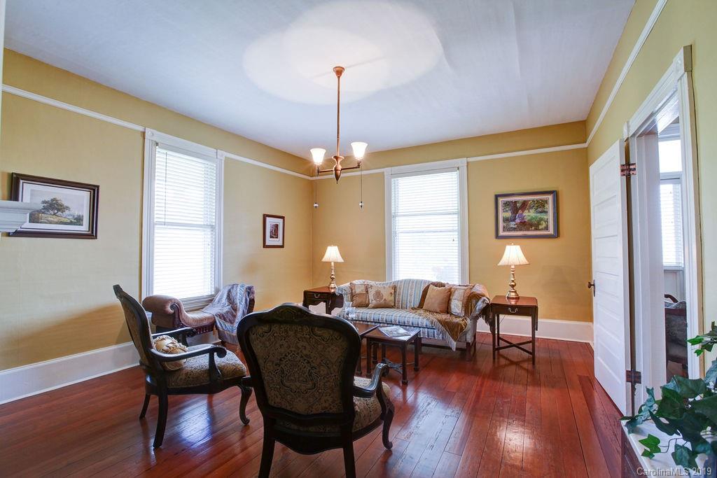 1003 Ferguson Ridge Road Gastonia, NC 28052 - Photo 5 of 36 a view of a dining room with furniture window and wooden floor