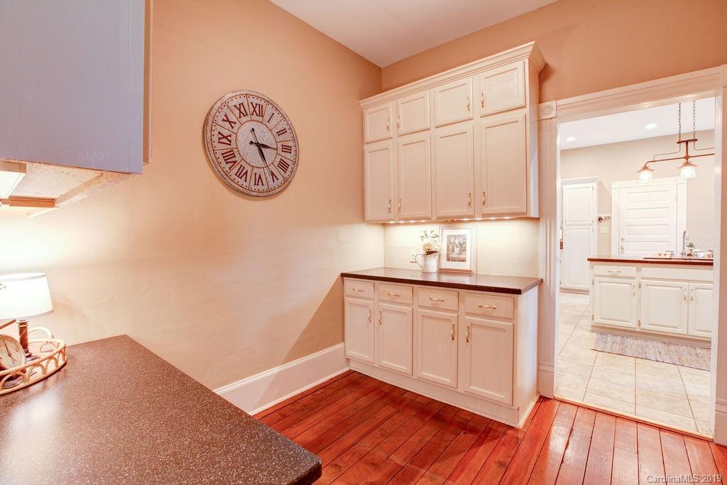 1003 Ferguson Ridge Road Gastonia, NC 28052 - Photo 7 of 36 a bathroom with a granite countertop sink and a large mirror