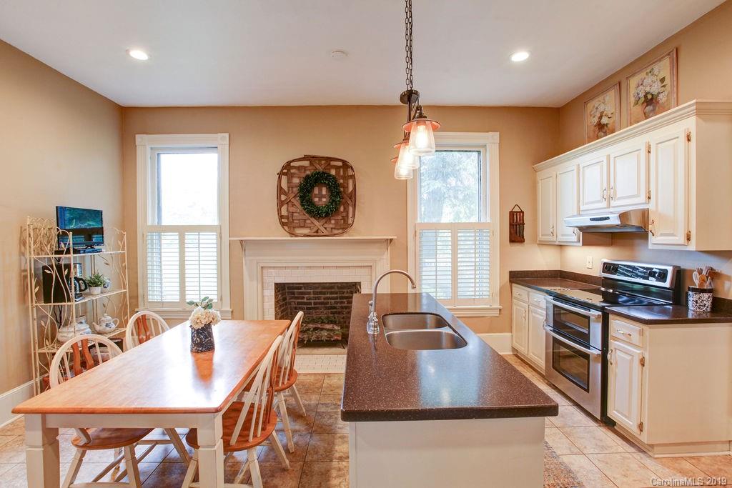 1003 Ferguson Ridge Road Gastonia, NC 28052 - Photo 10 of 36 a living room with furniture a fireplace and a large window