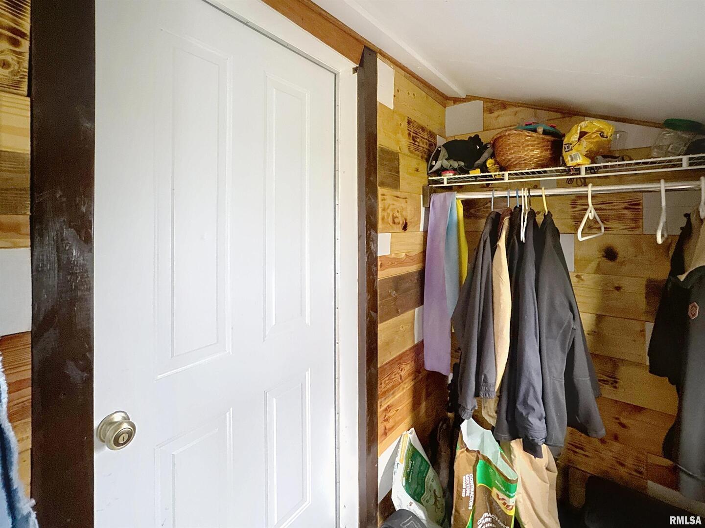 2320 18th Street A Moline, IL 61265 - Photo 11 of 17 a view of walk in closet with clothes and shoes