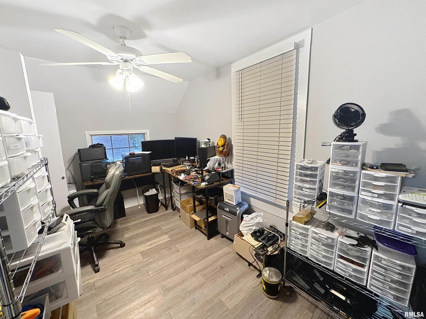 2320 18th Street A Moline, IL 61265 - Photo 12 of 17 a view of a workspace with furniture and a window