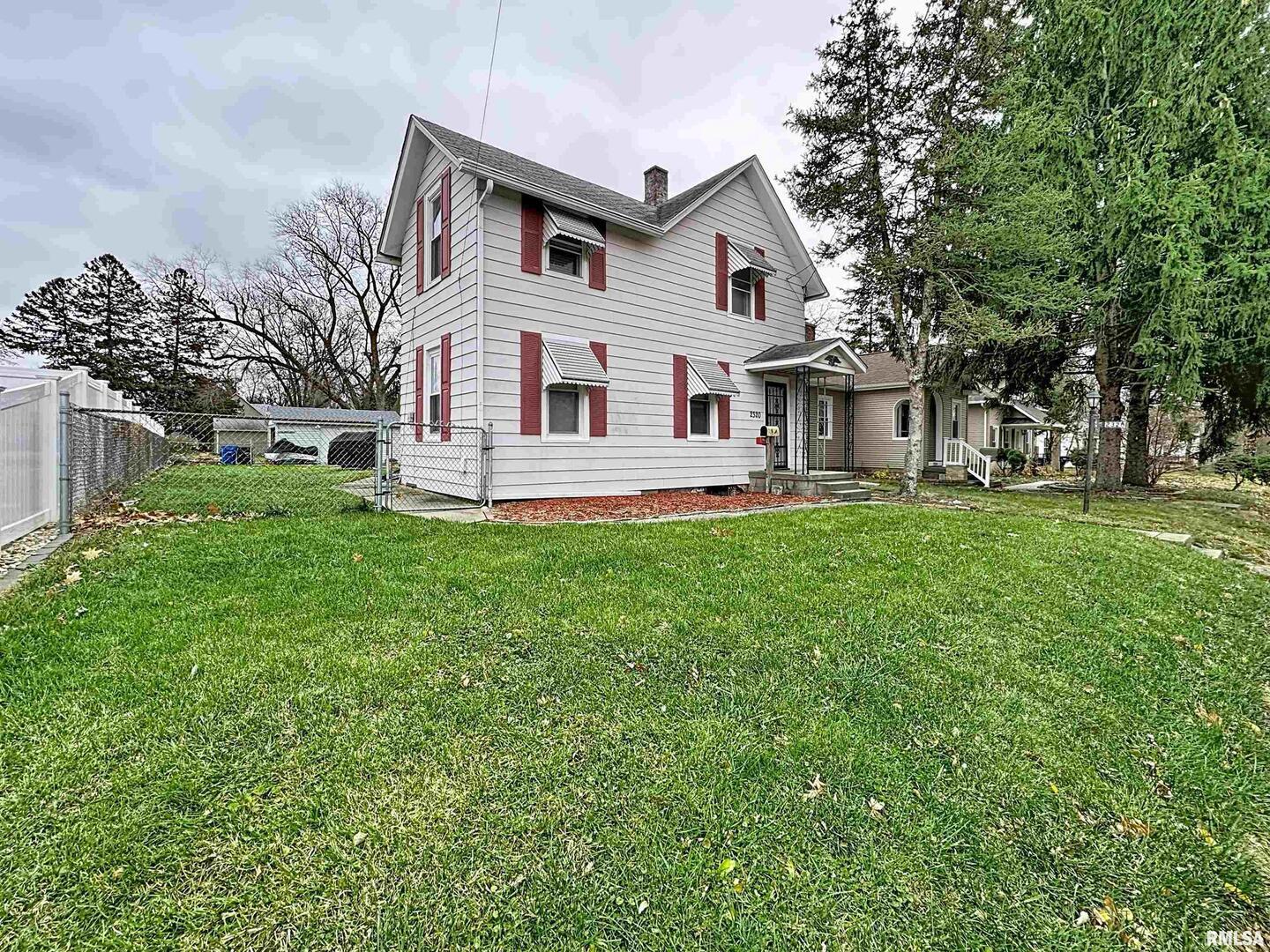2320 18th Street A Moline, IL 61265 - Photo 2 of 17 a front view of a house with a yard