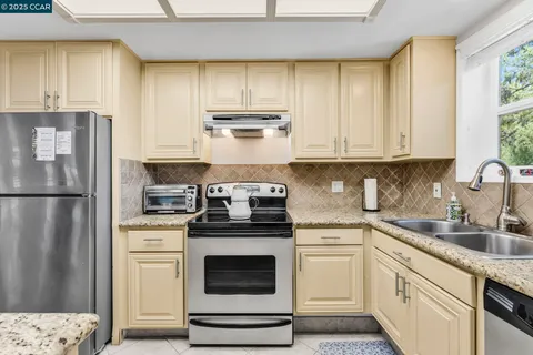 a view of a kitchen area with furniture and window
