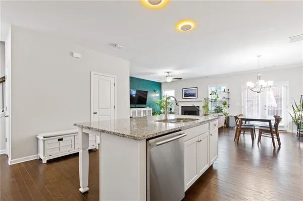 a kitchen with cabinets and outdoor seating
