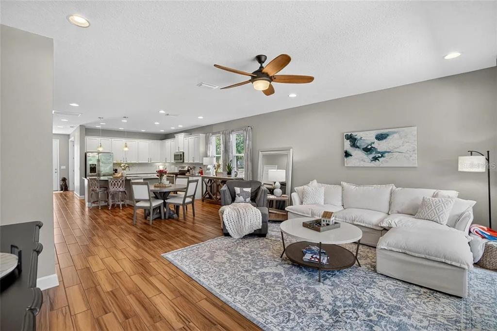 14302 Rolling Dune Road Lithia, FL 33547 - Photo 15 of 88 a living room with furniture and kitchen view