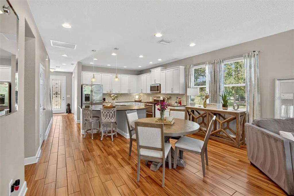 14302 Rolling Dune Road Lithia, FL 33547 - Photo 19 of 88 a view of a dining room with furniture window and wooden floor