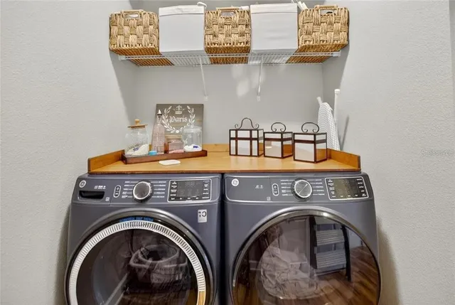 a view of a terrace with a table and chairs