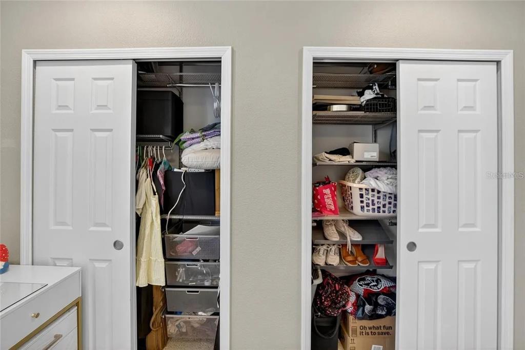 14302 Rolling Dune Road Lithia, FL 33547 - Photo 23 of 88 a view of walk in closet with clothes and shoes