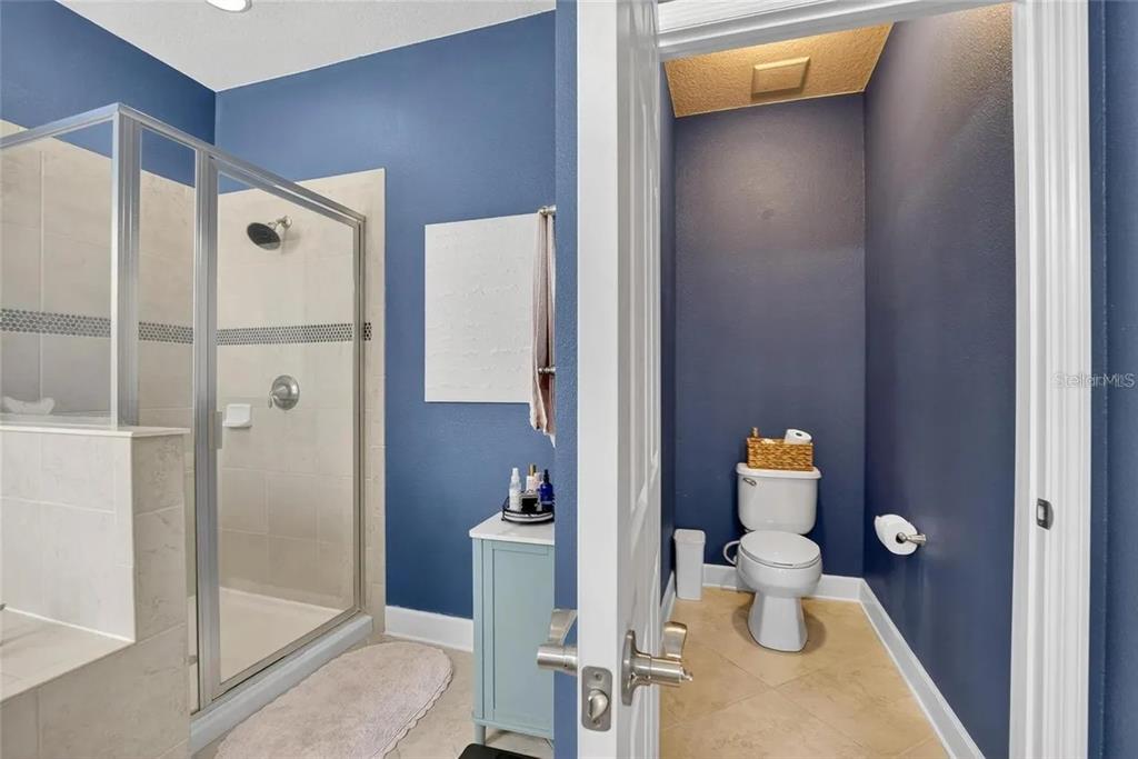 14302 Rolling Dune Road Lithia, FL 33547 - Photo 25 of 88 a bathroom with a toilet and a shower