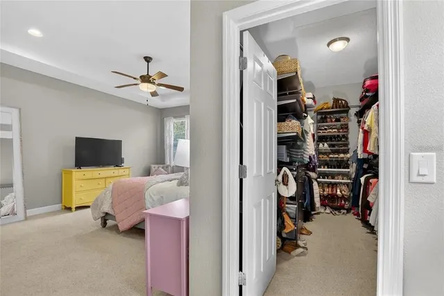 an empty room with a ceiling fan and a ceiling fan