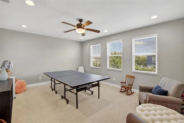 an aerial view of multiple houses with a yard