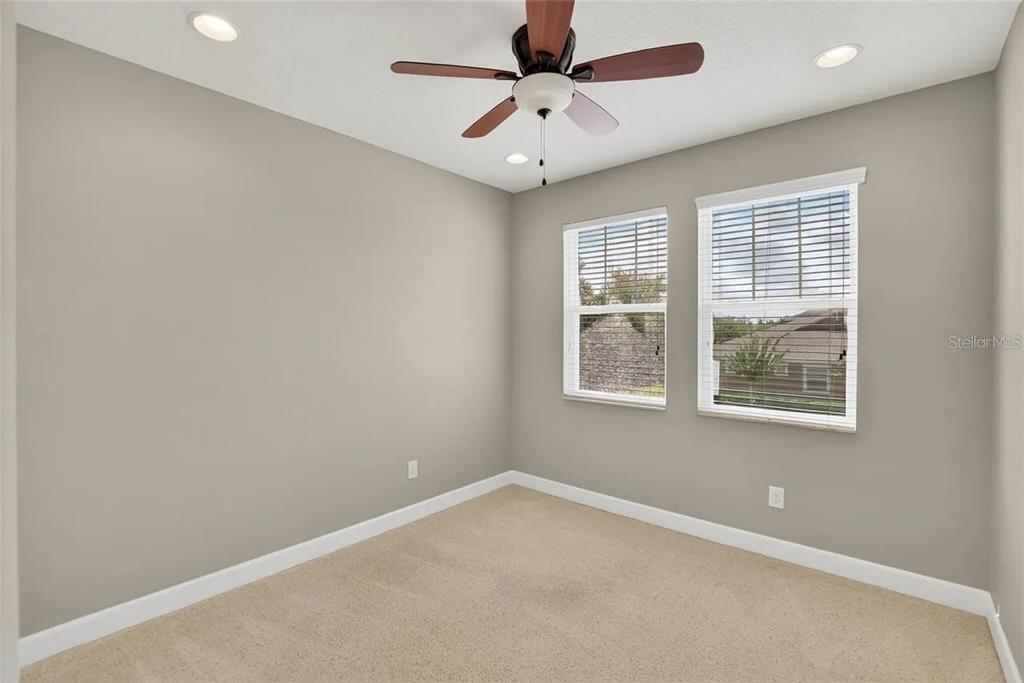 14302 Rolling Dune Road Lithia, FL 33547 - Photo 50 of 88 an empty room with a window and a fan