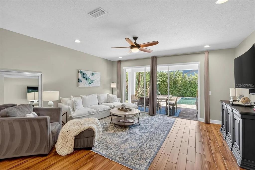 14302 Rolling Dune Road Lithia, FL 33547 - Photo 55 of 88 a living room with furniture and a large window
