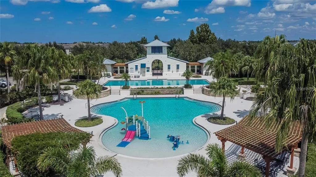 14302 Rolling Dune Road Lithia, FL 33547 - Photo 72 of 88 a front view of a house with swimming pool garden and patio