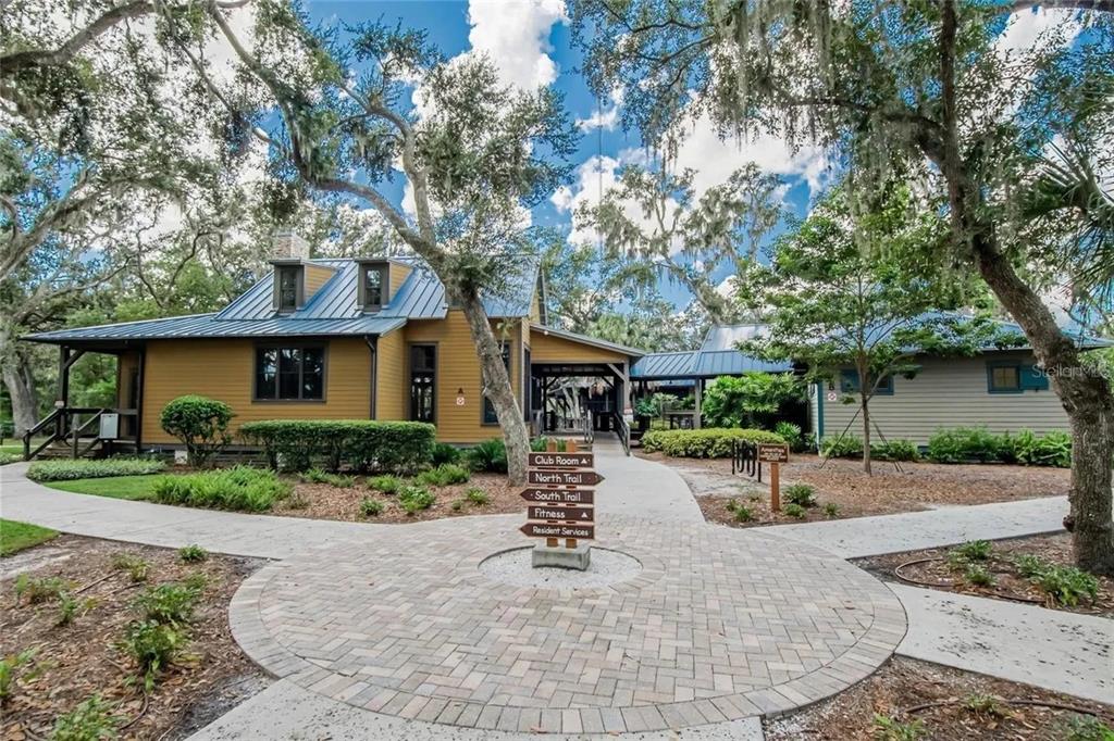 14302 Rolling Dune Road Lithia, FL 33547 - Photo 84 of 88 a front view of a house with a yard and potted plants