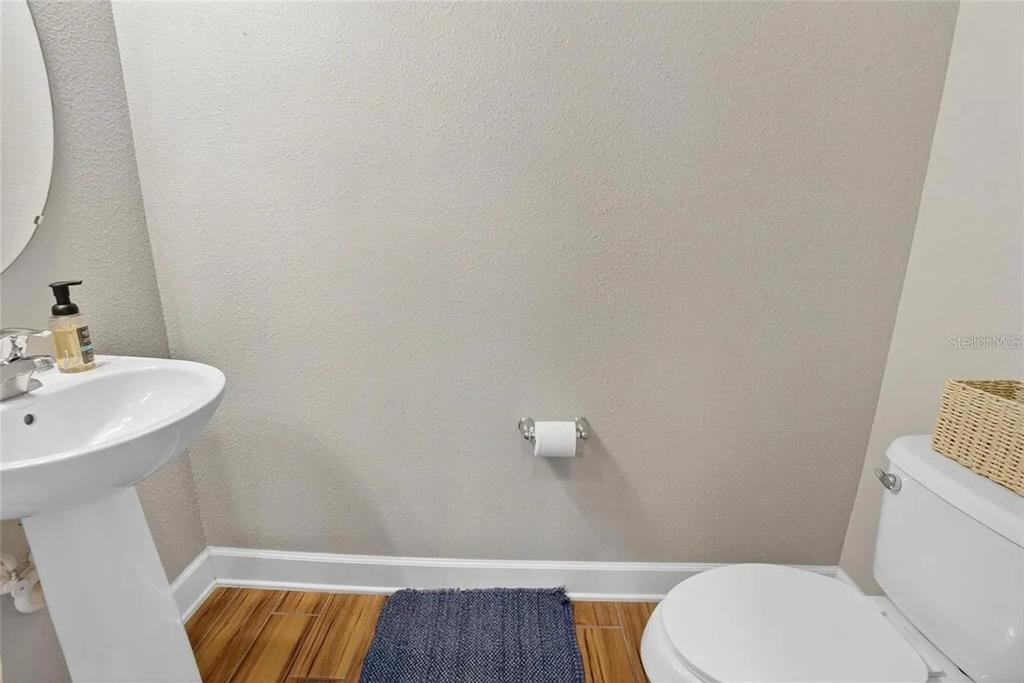 14302 Rolling Dune Road Lithia, FL 33547 - Photo 9 of 88 a bathroom with a sink and a toilet